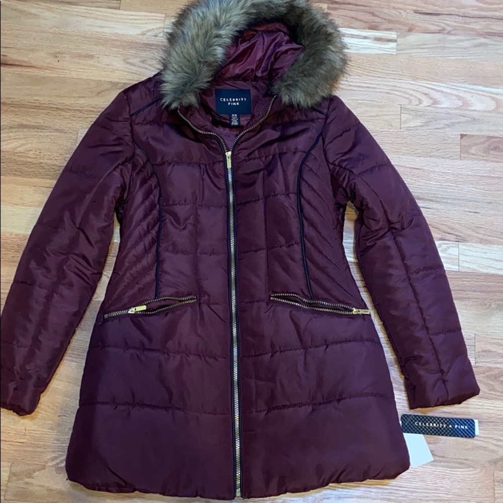 Mid-thigh length water resistant maroon jacket